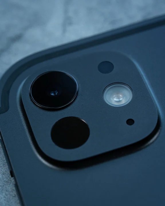 Macro close-up view of the rear camera module on a tablet.