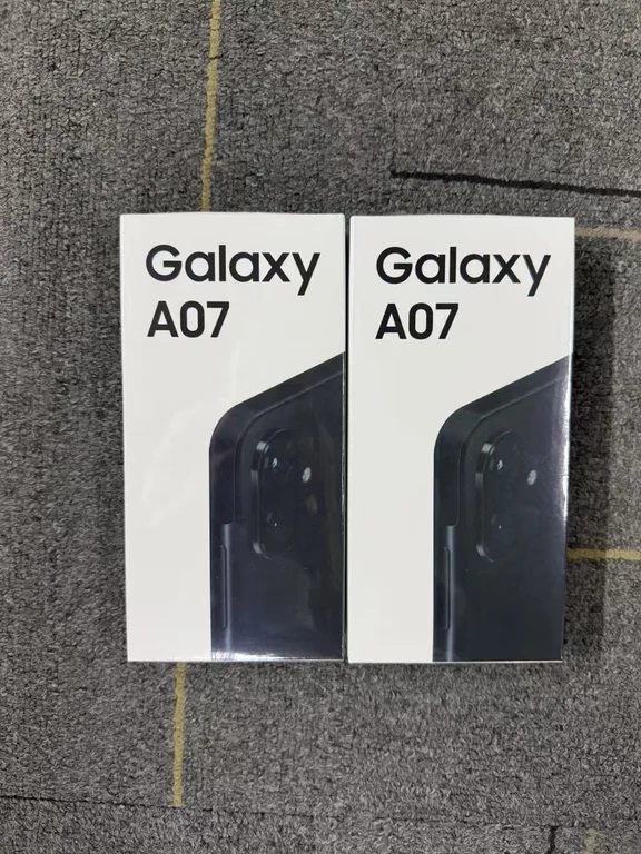 Two retail boxes of the Samsung Galaxy A07 smartphone sitting side by side