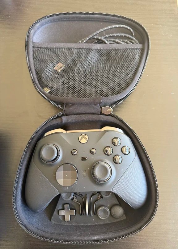 Xbox Elite Series 2 controller with swappable paddles and cable inside its travel case