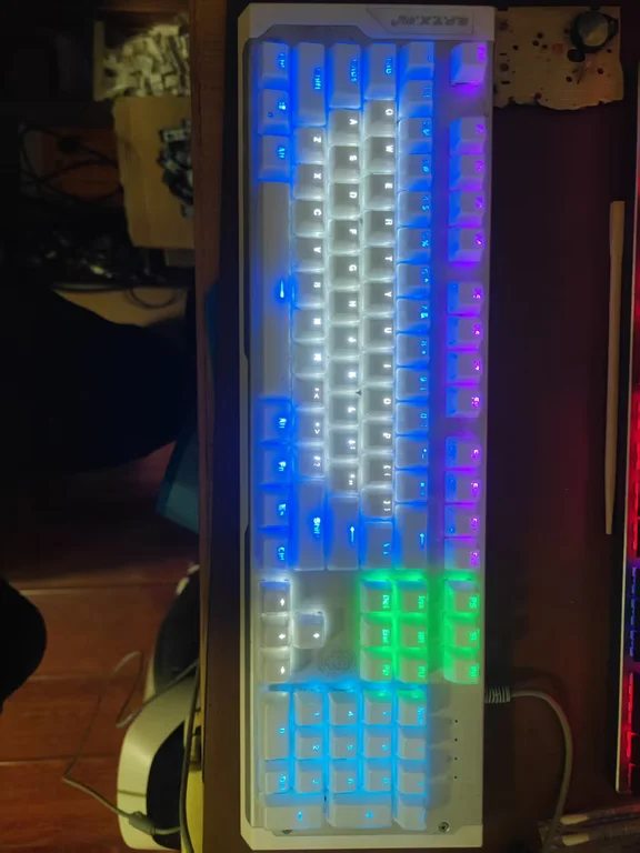 Full-size white gaming keyboard with glowing multicolored backlighting
