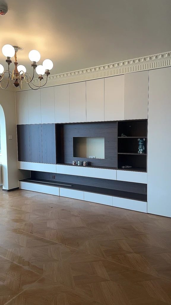 Large custom built-in entertainment center with a recessed niche for a TV